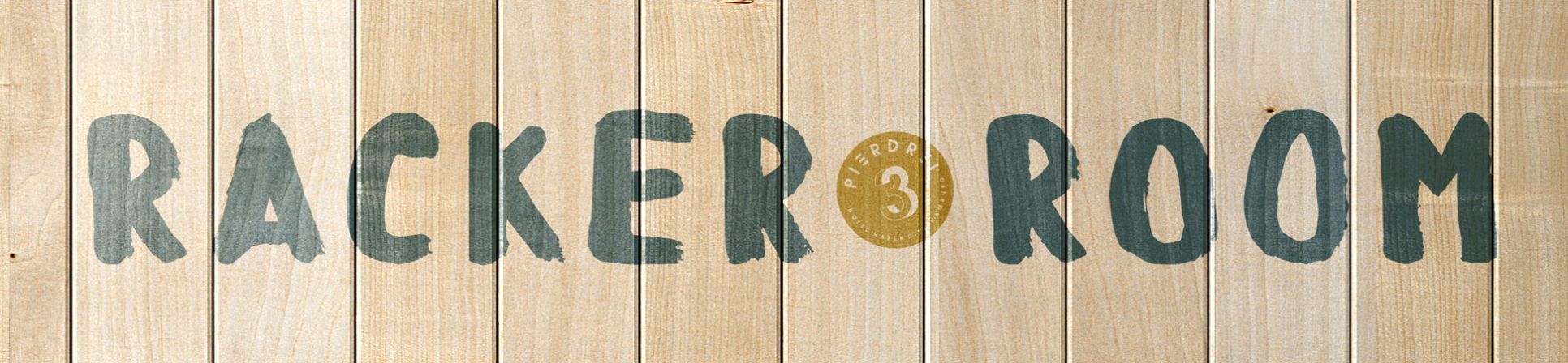 logo of the RACKER ROOM painted on a wooden wall