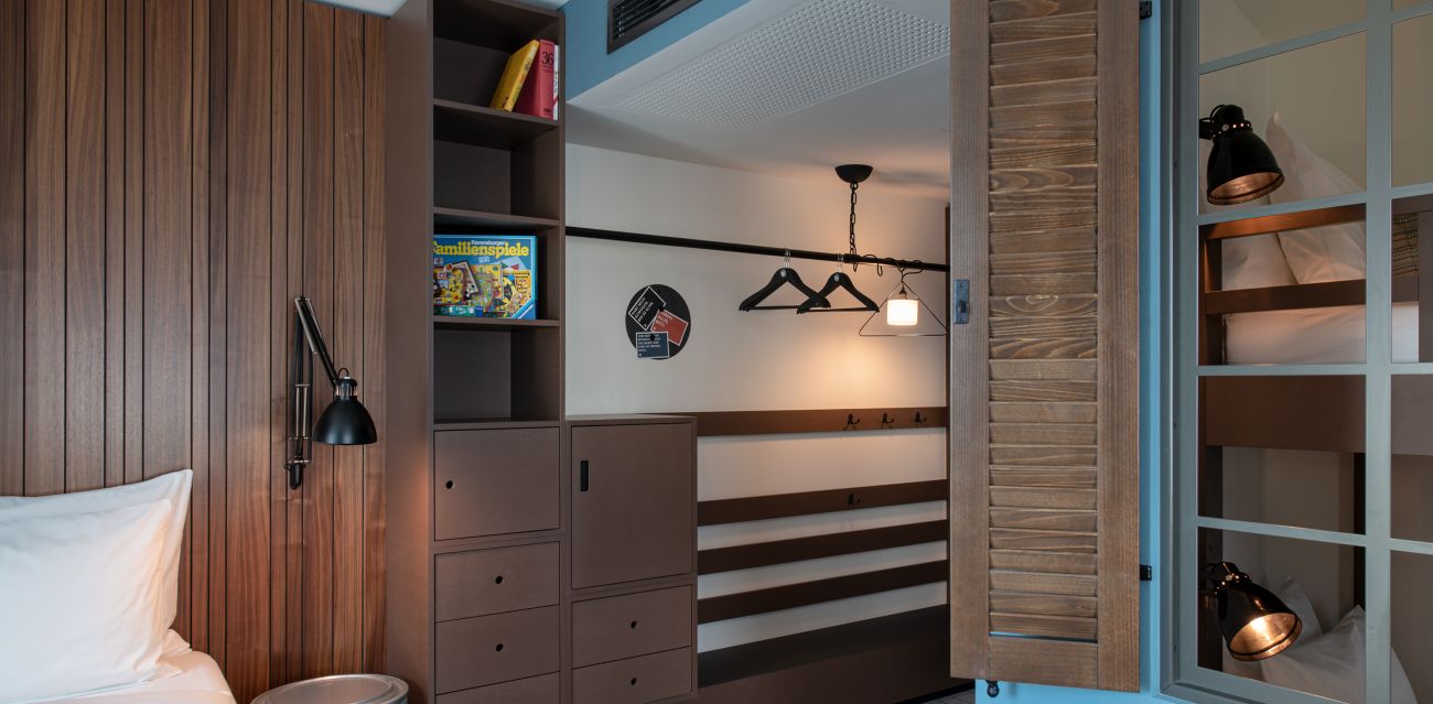 View of the minibar and bunk bed in the XL Large room category