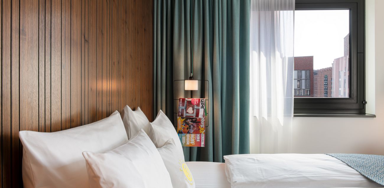 Close-up of the bed in a room of the MEDIUM category